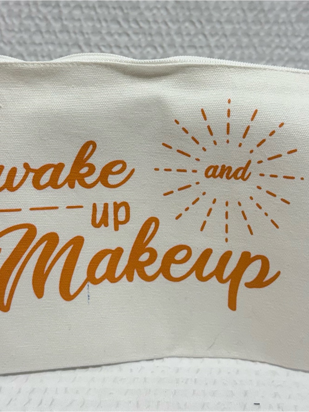 Makeup Pouch - Cream with Orange Lettering